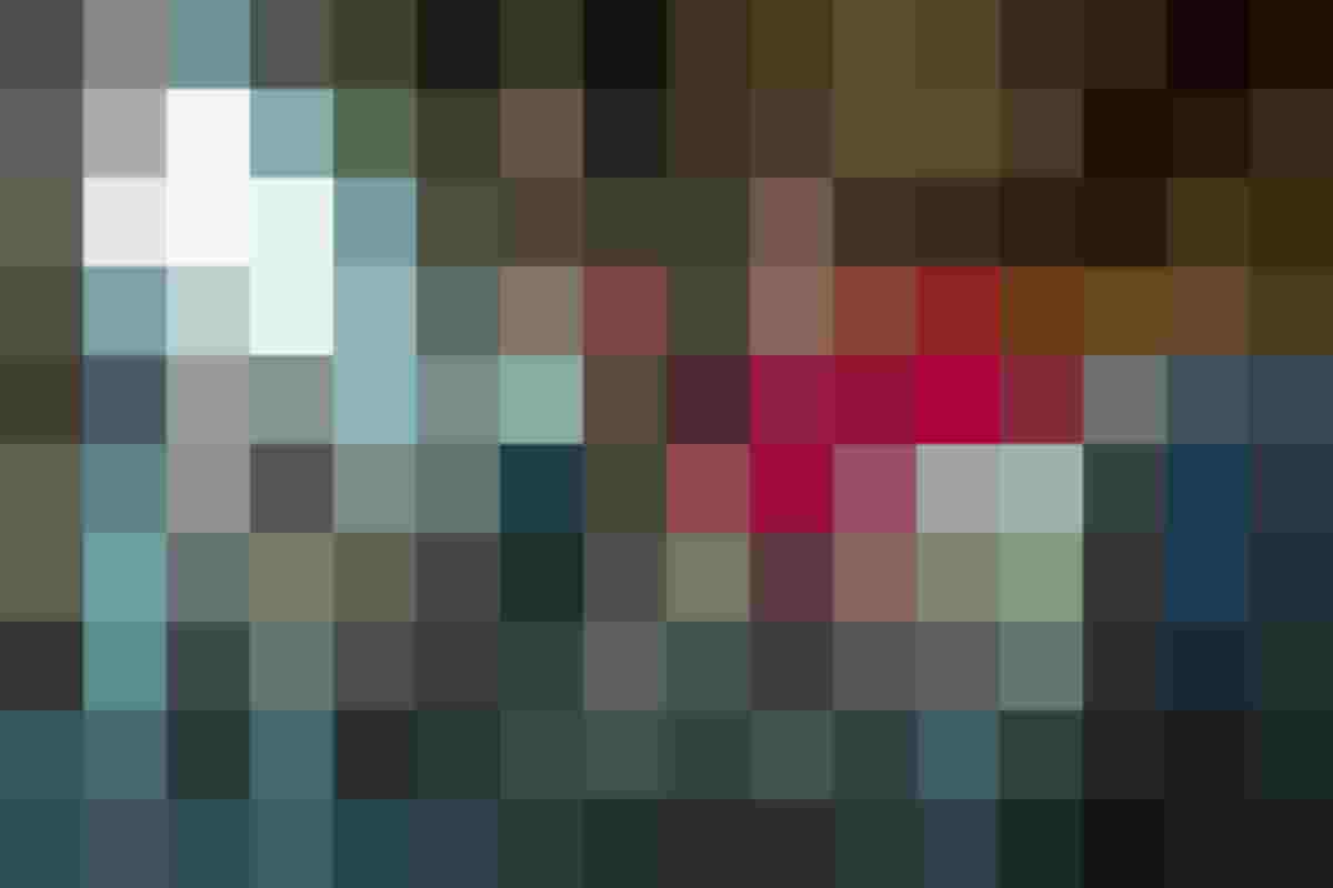 Ein Ausbilder der Metallbearbeitung zeigt seinem Auszubildenden eine der Maschinen in der Schlosserei