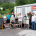 Gruppe mit Kunstobjekten vor dem MoKuBa-Container, daneben eine Tafel zum EUREGIO-Projekt